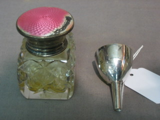 A silver plated perfume funnel and a cut glass salts jar with silver and enamel lid (f)