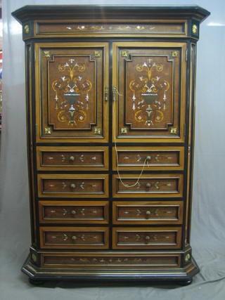 A 20th Century Florentine inlaid figured walnut cabinet, the upper section with moulded cornice and cupboard enclosed by panelled doors, above 8 short drawers, raised on a platform base 46"
