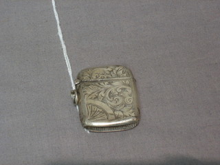 An engraved silver vesta case with hinged lid