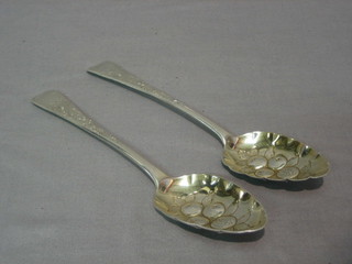 A pair of Georgian Old English silver pattern table spoons with embossed decoration 4 ozs