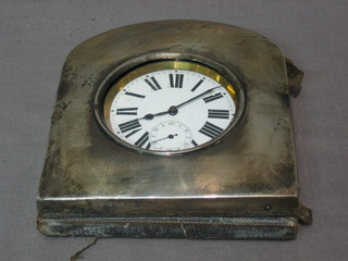 A large travelling timepiece contained in an open faced silver plated case, contained in a silver travelling case Birmingham (marks rubbed)