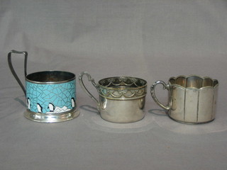 2 WMF glass holders and a silver plated and enamelled glass holder decorated penguins