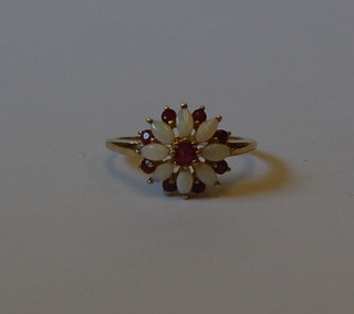 A lady's 9ct gold floral design dress ring set opals and rubies