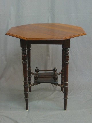 An Edwardian octagonal walnut occasional table, raised on turned supports with undertier 27"