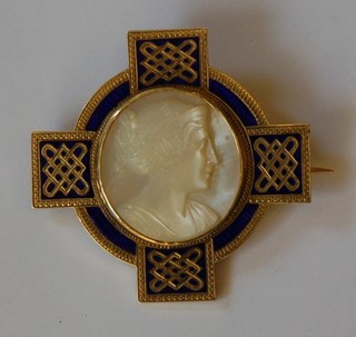 A gilt metal and enamelled brooch in the form of a cross set a carved mother of pearl panel decorated a ladies portrait
