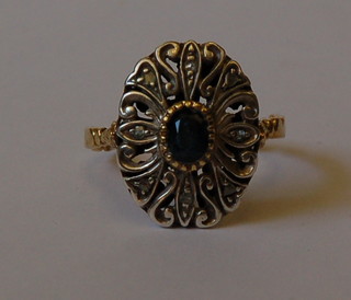 An 18ct gold dress ring set a sapphire