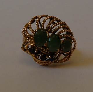 A lady's 14ct gold dress ring set 3 oval cut green stones