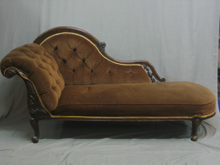 A Victorian mahogany show frame chaise longue upholstered in brown buttoned Dralon, raised on cabriole supports 66"