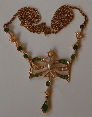 A gold pendant set peridots and demi-pearls