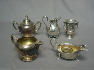 A silver plated sauce boat and a small collection of silver plated items