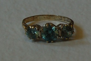 A 9ct gold dress ring set 3 light blue oval cut stones