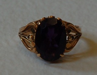 A lady's gold dress ring set an oval amethyst