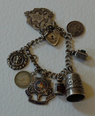 A silver charm bracelet hung 8 charms