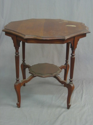 An Edwardian walnut octagonal occasional table, raised on turned and reeded supports, the undertier 29"