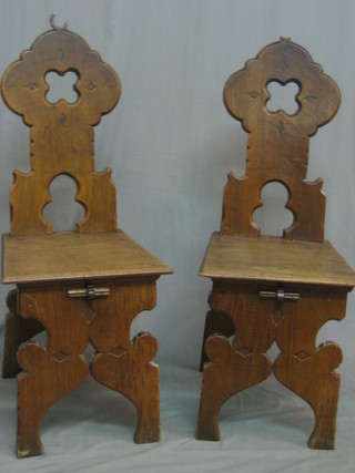 A set of 4 17th Century style "Italian" walnut hall chairs with pierced backs and solid seats