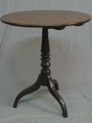 A 19th Century circular oak snap top tea table, raised on a turned column 26"