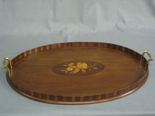 An Edwardian oval inlaid mahogany twin handled tea tray 22"