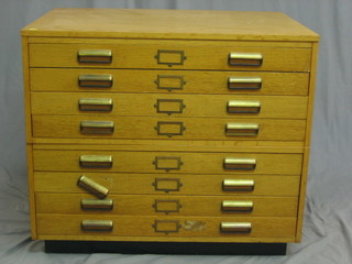 A 20th Century honey oak plan chest in 2 sections, fitted 8 long drawers 37"