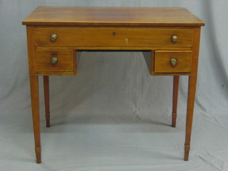 A Georgian mahogany side table fitted 1 long drawer above 2 short drawers, raised on square tapering supports ending in spade feet 35"
