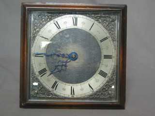 A mantel clock having a square dial, Roman numerals and silver chapter ring, contained in an easel frame 7 1/2"