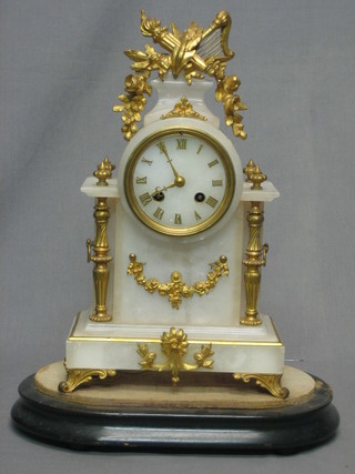 A French 8 day striking mantel clock contained in an alabaster case with gilt metal mounts