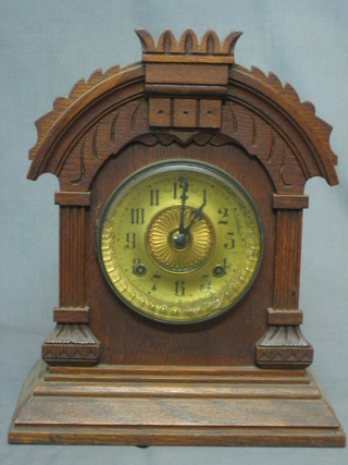 An American Ansonia 8 day striking shelf clock with painted dial contained in an oak case