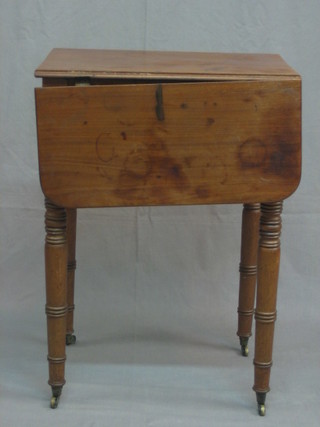 A 19th Century mahogany drop flap occasional table fitted 2 long drawers, raised on ring turned supports 20"