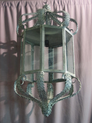 A large and impressive octagonal verdigris metal and glass Eastern hanging lantern (1 glass panel f)