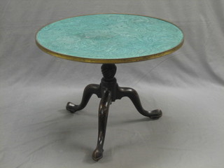 A 19th Century circular tea table with "malachite" top and brass banding raised on a turned column and tripod base 28"
