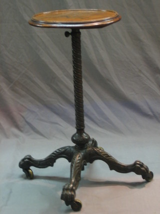 A walnut topped occasional table, raised on an iron and brass adjustable stand 14"