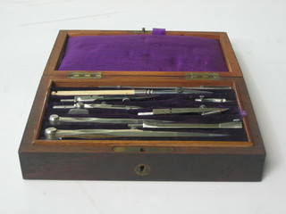 A cased set of 19th Century drawing instruments, contained in a mahogany case