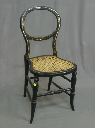 A pair of Victorian balloon back black papier mache bedroom chairs with woven cane seats