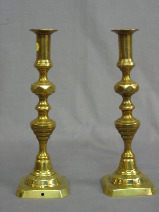 A pair of 19th Century brass candlesticks with knopped stems 12"