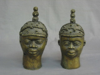 A pair of Eastern bronze busts in the form of heads 8"