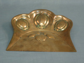 An Art Nouveau embossed copper crumb tray 9"