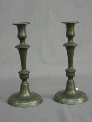 A pair of 19th Century pewter candlesticks with ejectors 10"