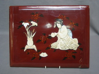 An Oriental lacquered book cover with applied ivory decoration decorated a seated Geisha with teapot 11" x 14" (some damage)