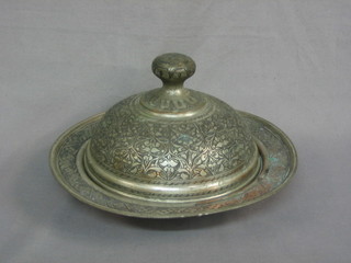 A circular Eastern engraved metal dish and cover 11"