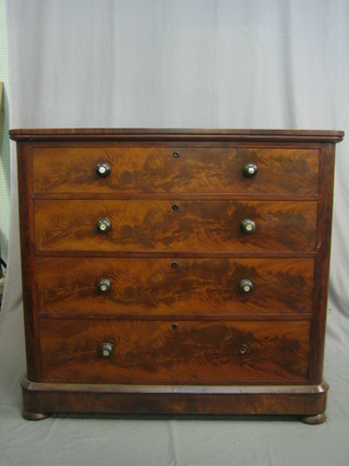 A Victorian mahogany D shaped chest of 4 long drawers with tore handles, raised on a platform base 48"