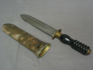A Navy double edged diver's knife in brass scabbard by Siebe Gorman