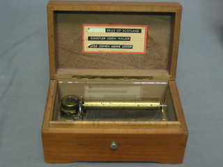A 20th Century Swiss musical box playing 3 aires, contained in a walnut case 6"