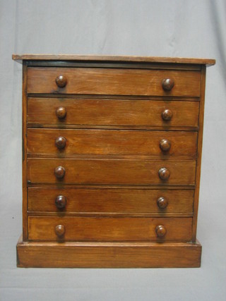 A Victorian mahogany coin collector's chest of 6 long drawers with tore handles, 15"