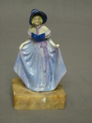 A Doulton style figure of a Crinoline lady raised on a marble base, 5"