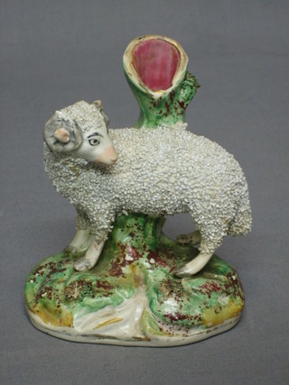 A 19th Century Staffordshire spill vase in the form of a standing ram 6"