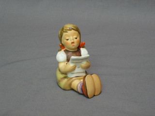 A Goebel figure of a seated girl singing 2"