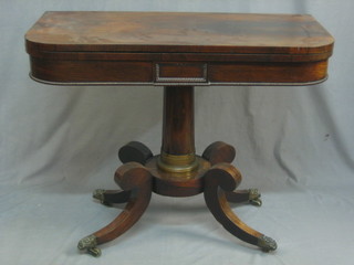 A William IV rosewood D shaped card table, raised on a turned column and tripod supports, 36"