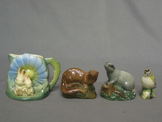 A Beswick figure of a Goldfinch 2" (chip to beak), 2 Beswick whisky miniatures in the form of a badger and an otter and a Hornsea jug