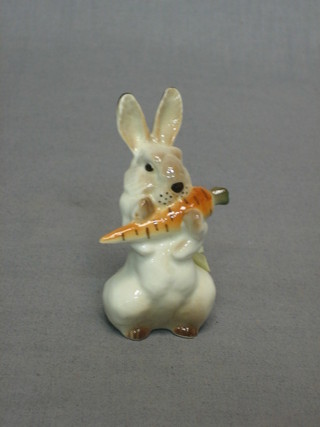 A Soviet Russian figure of a standing rabbit with carrot 3", base marked Made in USSR