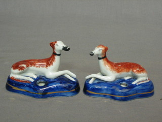 A pair of Staffordshire style  pen rests in the form of figures of greyhounds 3"