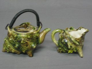 A Majolica style tea service in the form of a shell comprising teapot and cream jug 2"